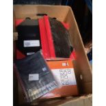 A box of office items, notepads and notebooks