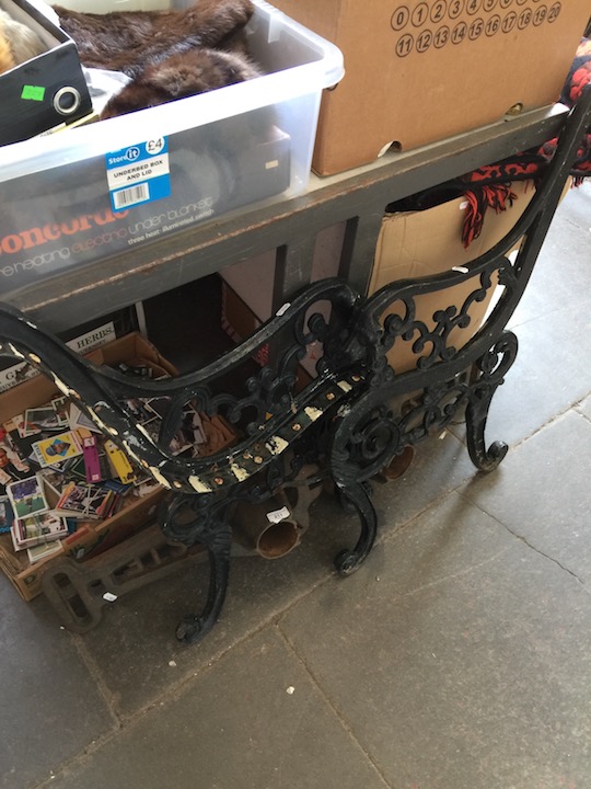 A pair of metal garden bench ends