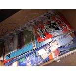 A box of football programmes.