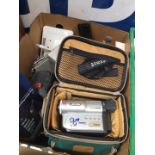 A box of misc electronics to include radios, walkman, camera equipment, video camera in case,