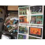 A box of postcards and albums cigarette cards