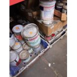 A large quantity of tins of paint