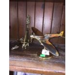 A group of collectable brass items to include a flying Spitfire on base, a set of brass large keys