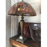 A modern table lamp with leaded glass shade