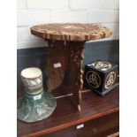 An Indian carved wood folding small table, a wooden box and a stoneware vase.