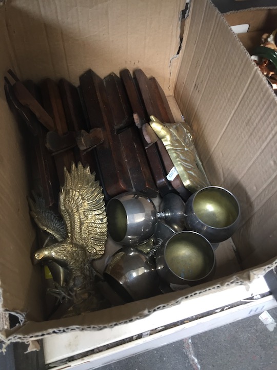 A box of brassware and wood planes