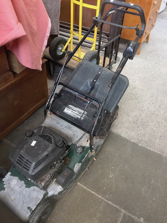 A Hayter petrol lawn mower.