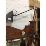 A vintage Planet angle poise lamp with clamp base