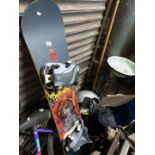 Two snow boards: Burton and Santa Cruz together with various accessories.