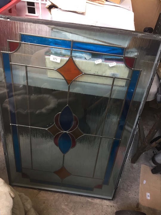 A double glazed stained glass panel 38 inches by 25 inches
