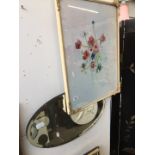 Oval bevelled mirror and a floral watercolour by G. macmillan Hughes