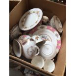 A box of Staffordshire china plates, cups etc