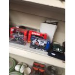 A collection of boxed model cars