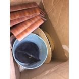 A box of misc including a straw boater, riding helmet and some wooden trays