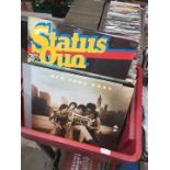 A box of LPs and 45s to include Beatles, Status Quo, etc.