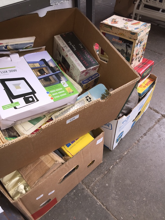 Three boxes of assorted items including junior playable bagpipes, books, three model cars, model