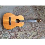 Old parlour guitar restrung natural finish