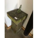 A metal sun dial on stone plinth, height 60cm.