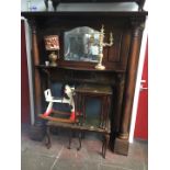 A large Edwardian fire surround with cornice top, mirror back flanked by carved panels, two