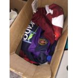 A box of Wigan Warriors rugby shirts