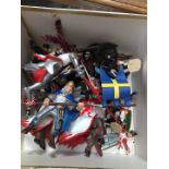 A collection of PAPO 2000 and other toy figurines to include knights, army, etc.