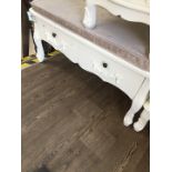 A French style white painted two drawer bench seat with floral swags and bow moulding to drawer