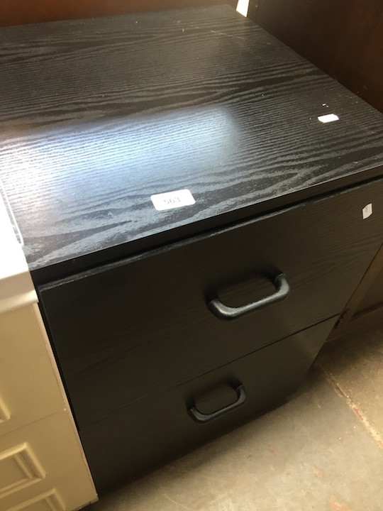 Black veneer filing drawers.