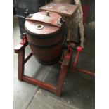 A wooden butter churn