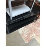 A black glass TV stand.