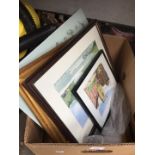 A box of pictures and 2 walking sticks