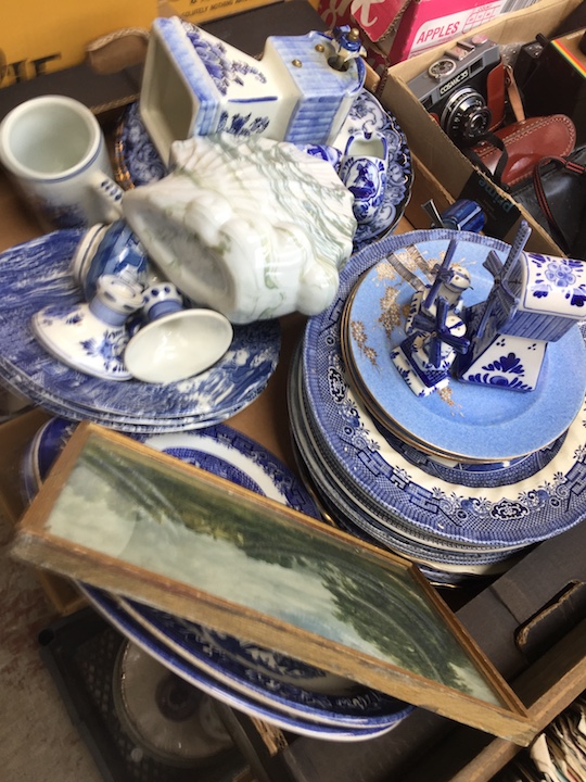 A crate of blue and white pottery including Delft