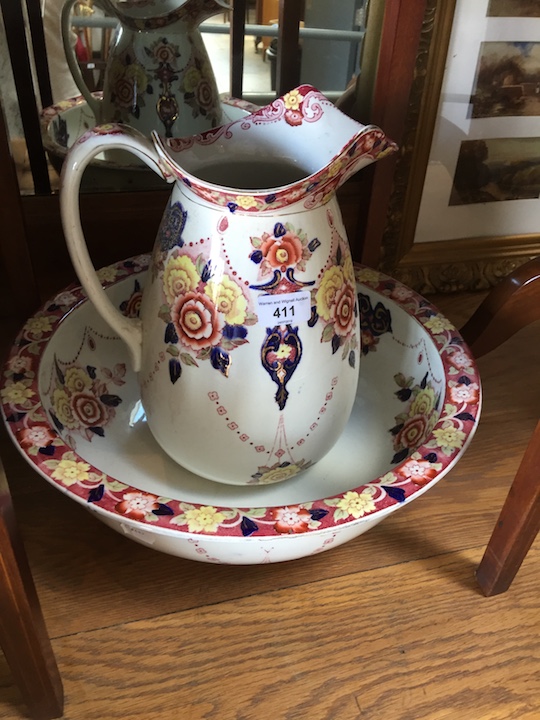 An Edwardian wash jug and bowl decorated with floral sprays, height 32cm.