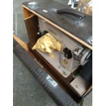 An electric Singer sewing machine with pedal, accessories, lead - in original case.