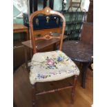 A French 19th century fruitwood inlaid bedroom chair with inset painted portrait medallion.