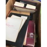 A box of stamp albums and covers
