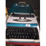 A vintage SCM Smith Corona Zephyr II typewriter in original case.