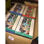 A box of football card sets.