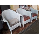 Three blue woven armchairs