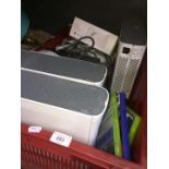A box of Xbox 360 consoles, controllers, headphones, etc.