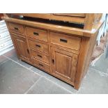 A modern G-Plan hardwood sideboard with granite inserts.