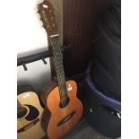Old parlour guitar restrung natural finish