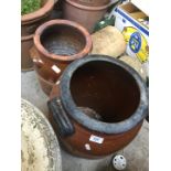 Two large brown stoneware urns