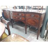 An reproduction inlaid mahogany serpentine sideboard