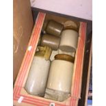 A box of stone ware jars