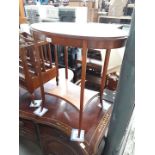 An Edwardian two tier oval occasional table.