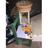 A childs chair and a vintage nursery storage piece