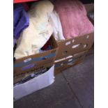 Four boxes of bedding, towels etc