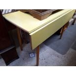 A melomine drop leaf table