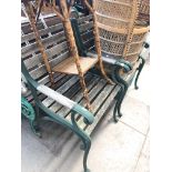 A pair of chairs with cast metal ends
