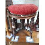 A Victorian piano stool